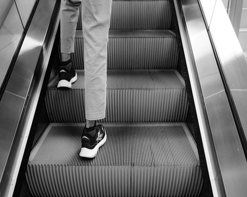 Person taking the stairs instead of the elevator